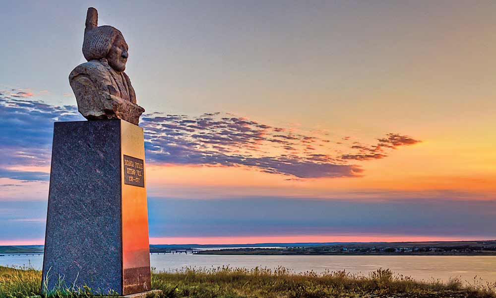 The second burial site of revered Lakota leader Sitting Bull sits on an isolated, scenic bluff overlooking the broad Oahe Reservoir on the Missouri River across from Mobridge, South Dakota, on the Standing Rock Sioux Reservation. – Photo by Chad Coppess – 