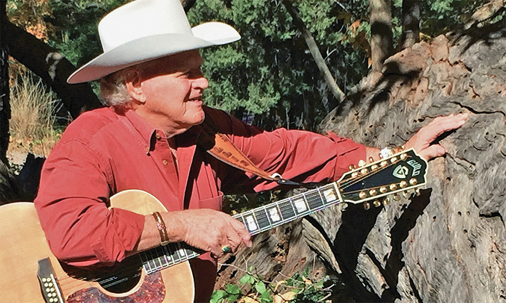 dolan ellis singer songwriter what history has taught me guitar hat cowboy true west magazine