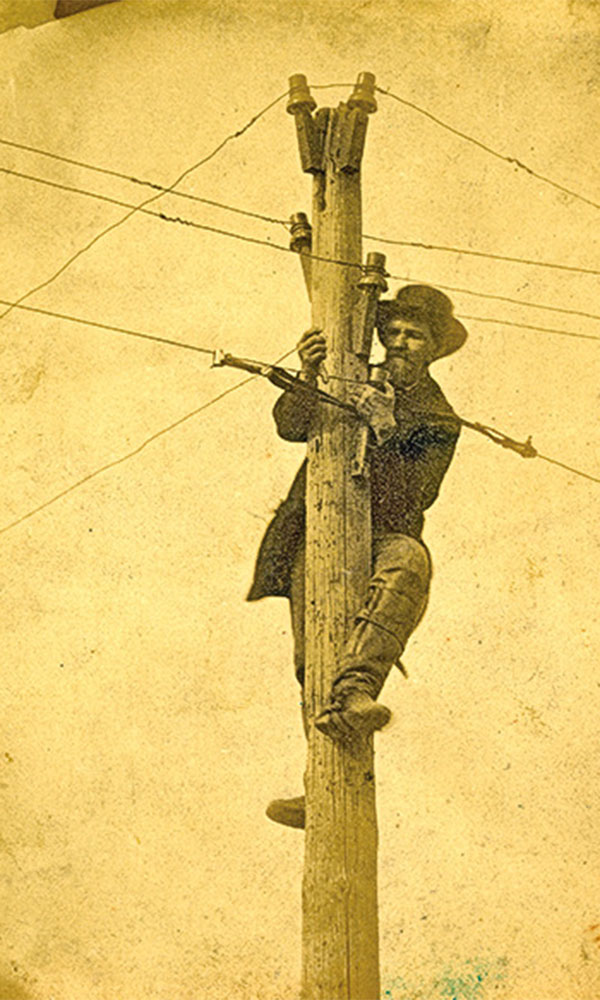 man with telegraph lines true west magazine