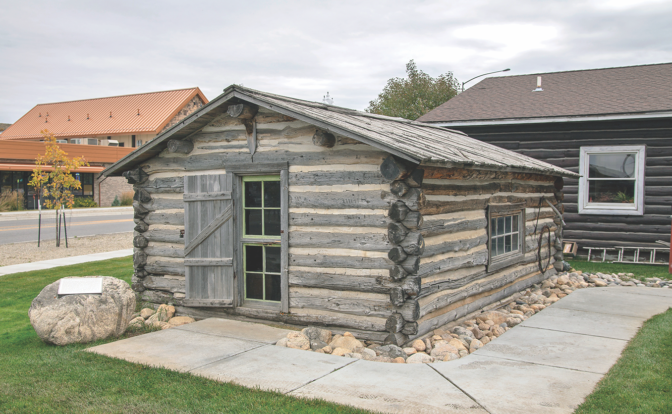 https://truewestmagazine.com/wp-content/uploads/2022/05/Red-Lodge-CVB-Jeremiah-Johnson-cabin_scaled.png